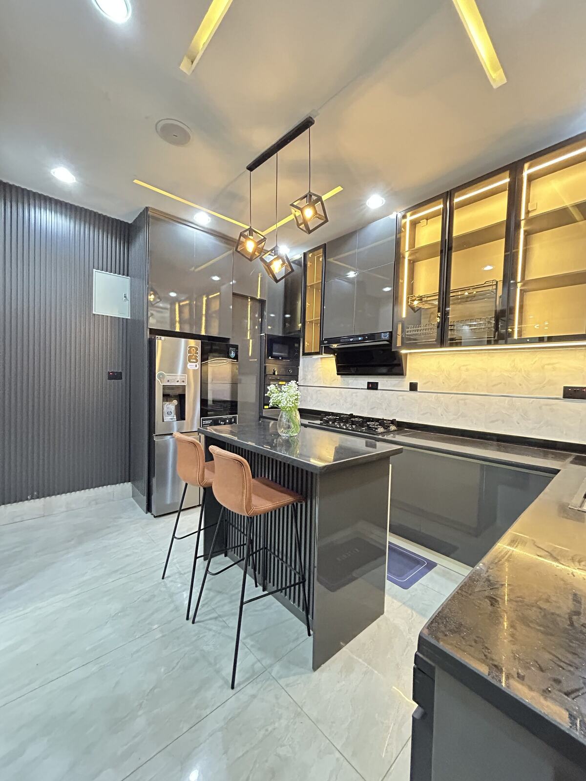 Kitchen with dark glass-front cabinets, alternate view