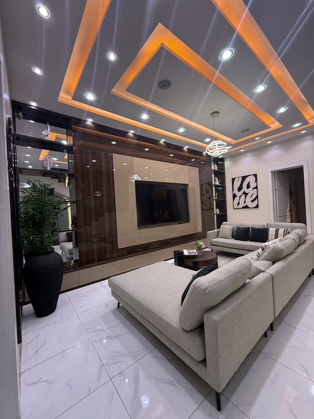 Living room lounge with statement ceiling lighting